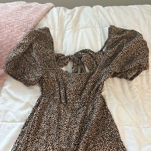 Francesca’s Full Body Leopard Print Flowy Jumpsuit
